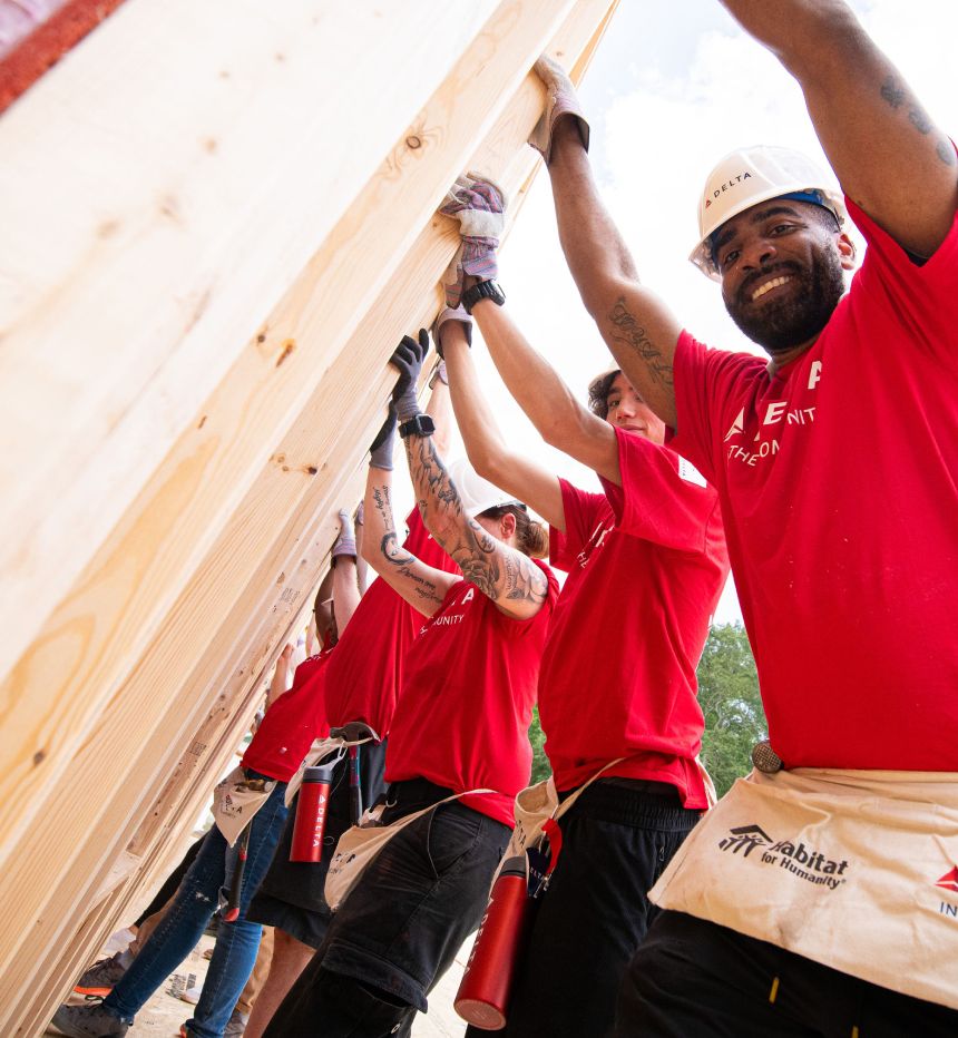 Delta employees volunteering at a habitat for humanity build event