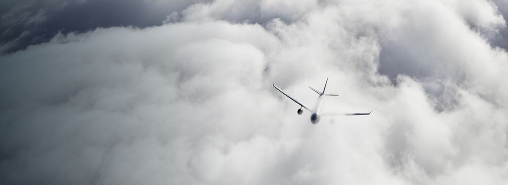 Aircraft flying through clouds