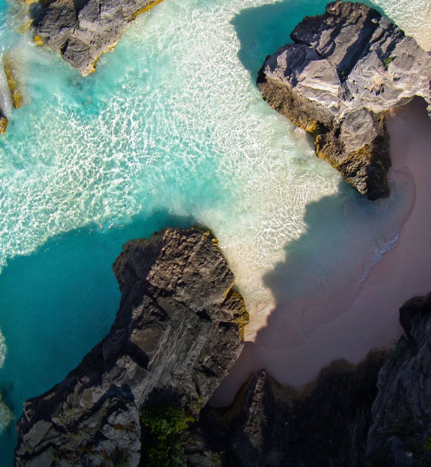 A birdseye view of a beach with clear water