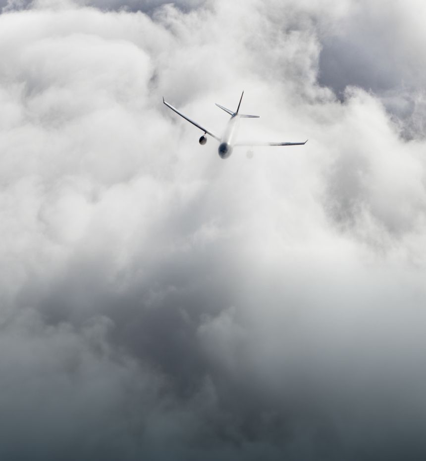 Aircraft flying through clouds