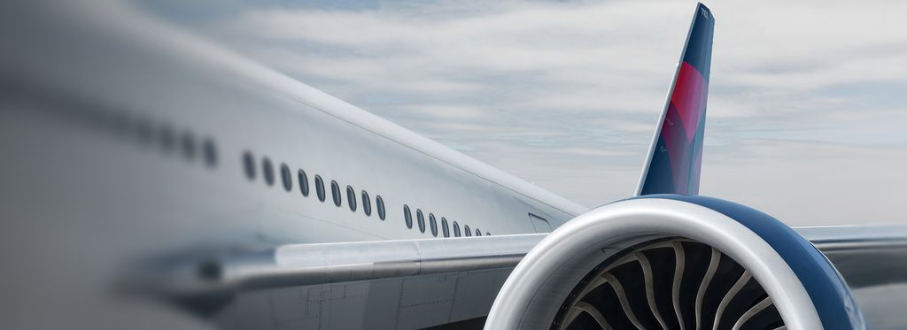 A close-up view of the engine on a Delta airplane.