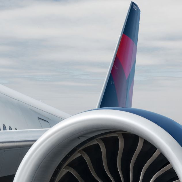A close-up view of the engine on a Delta airplane.
